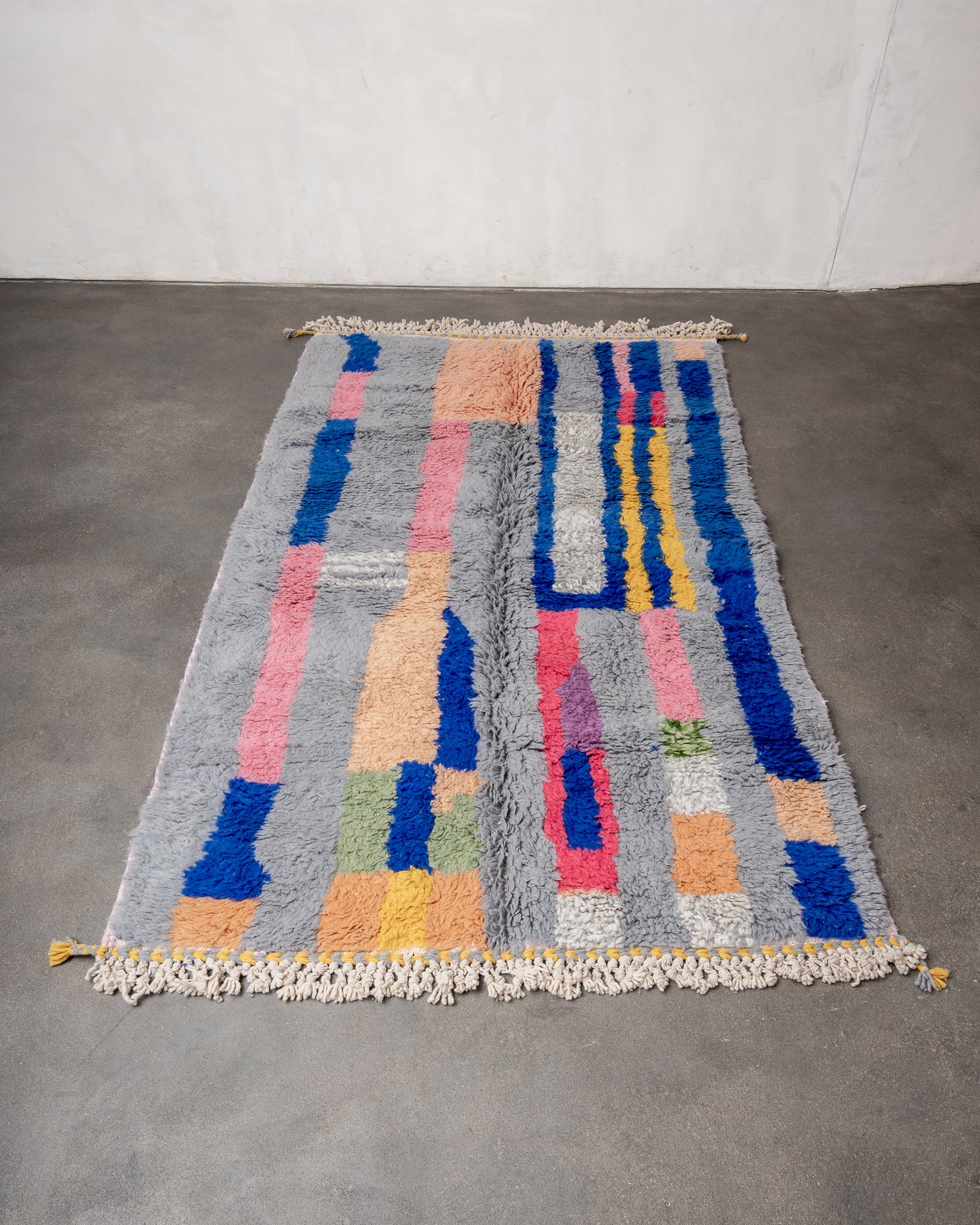 Modern, designer, handcrafted Berber rug from Morocco. Beniourain carpet with beautiful colours and patterns and fluffy wool texture.